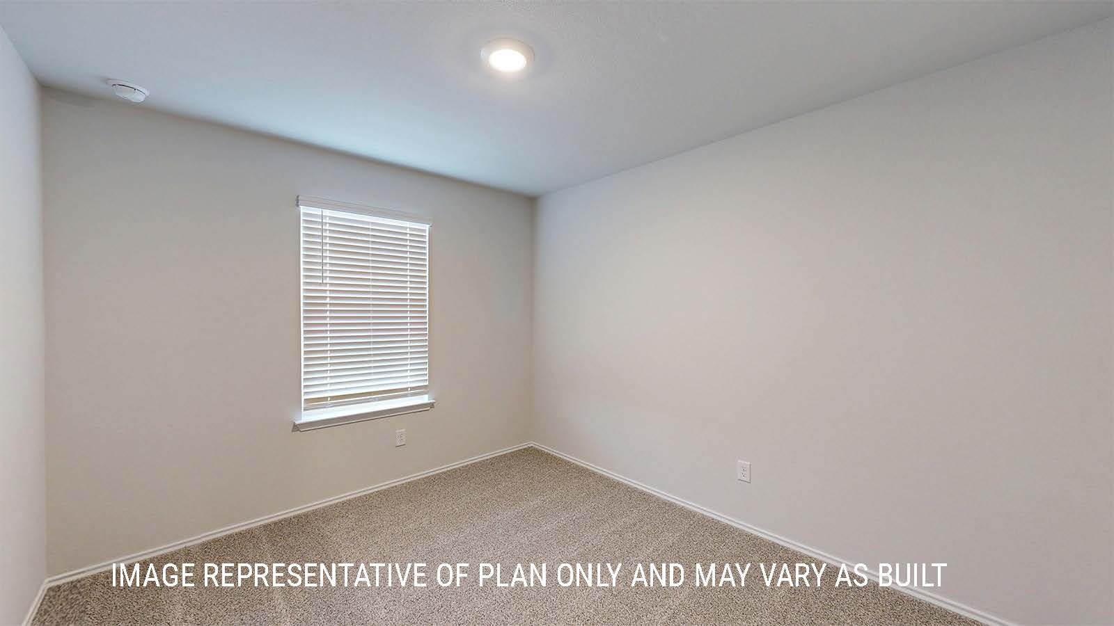 Grace secondary bedroom with carpeted flooring and window for lighting.