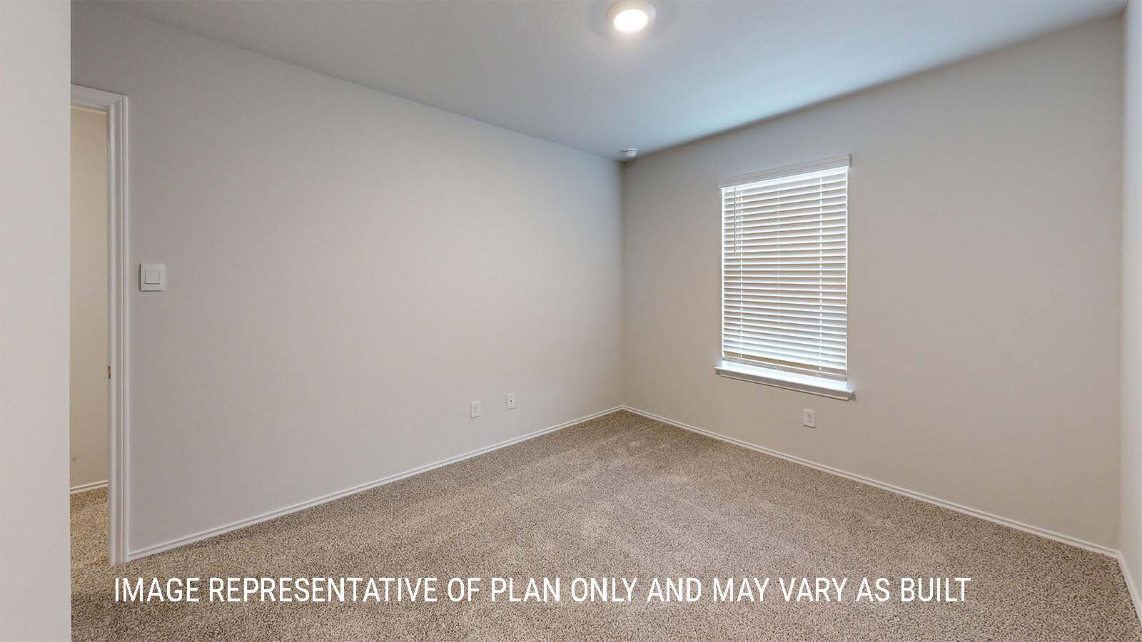 Grace secondary bedroom with carpeted flooring and window for lighting.