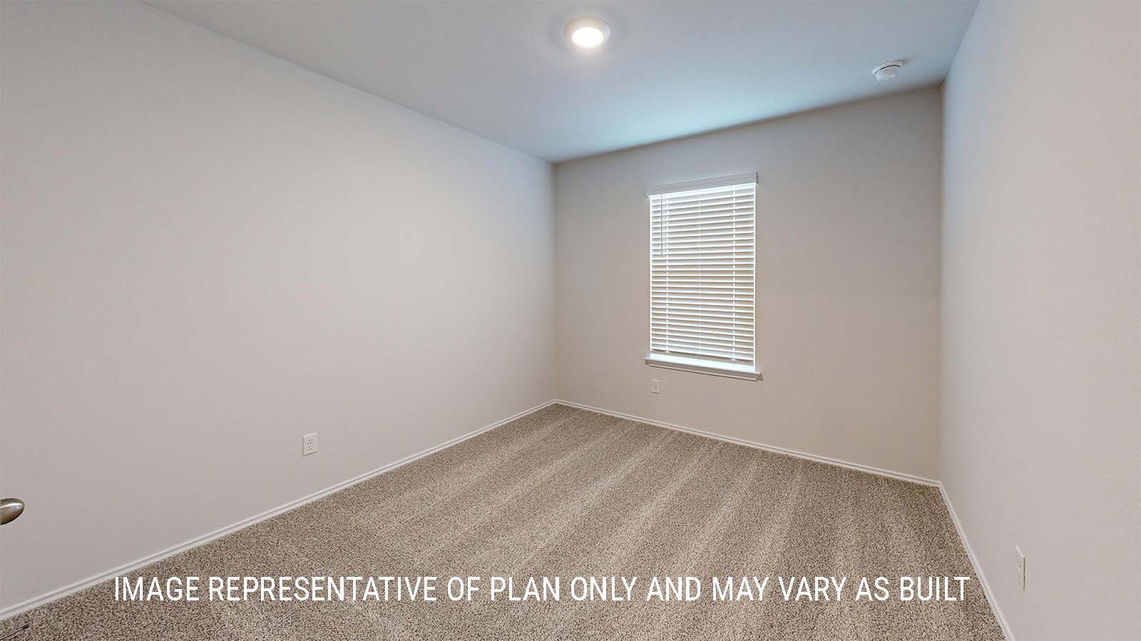 Grace secondary bedroom with carpeted flooring and window for lighting.