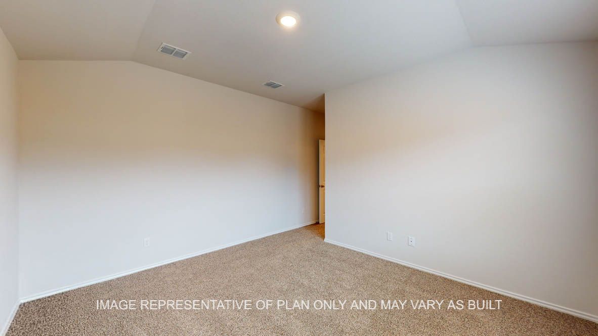 Abbot primary bedroom with carpet flooring and view of bedroom door.