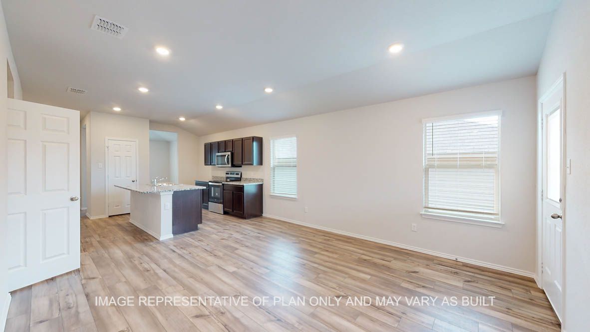 Abbot dining room with view of back door and kitchen.