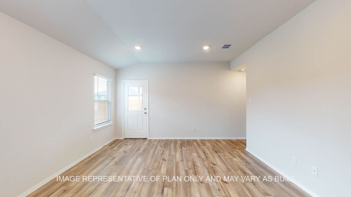 Abbot living room with vinyl plank flooring and view of back door.