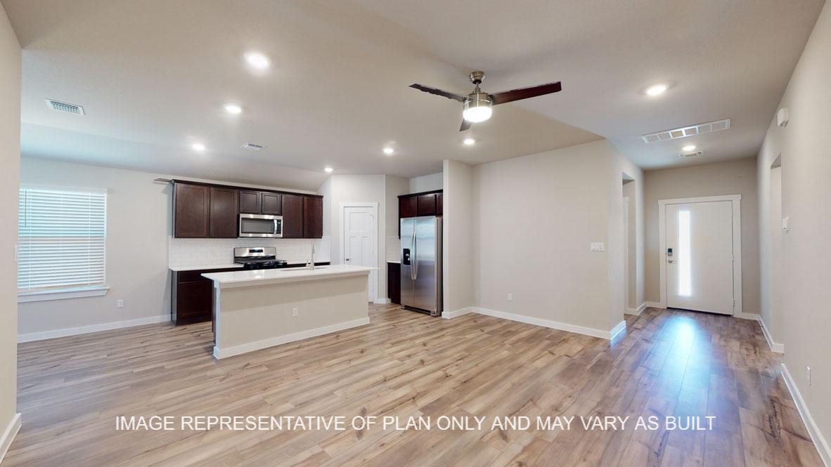Baxtor living room with view to entry and kitchen.