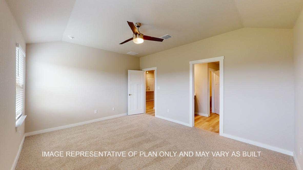 Easton primary bedroom with carpet flooring and connected bathroom.