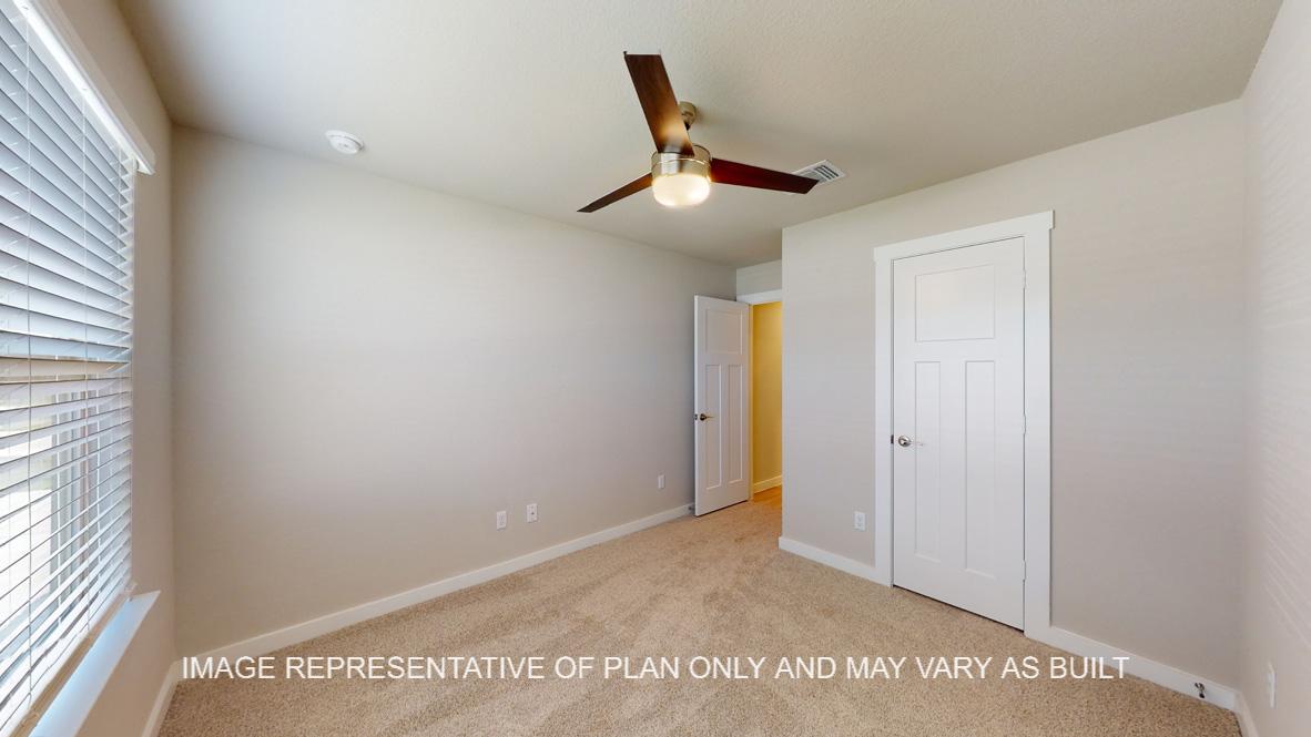 Easton secondary bedroom with carpet flooring and modern ceiling fan.
