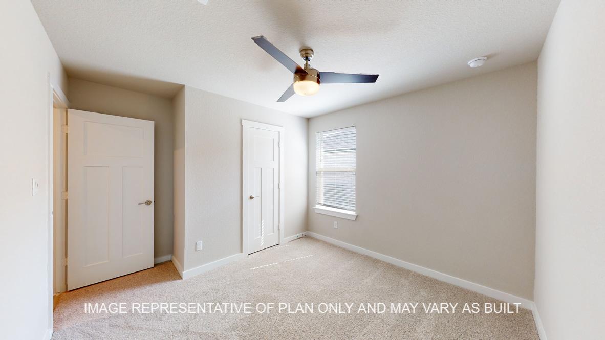 Easton secondary bedroom with carpet flooring and modern ceiling fan.