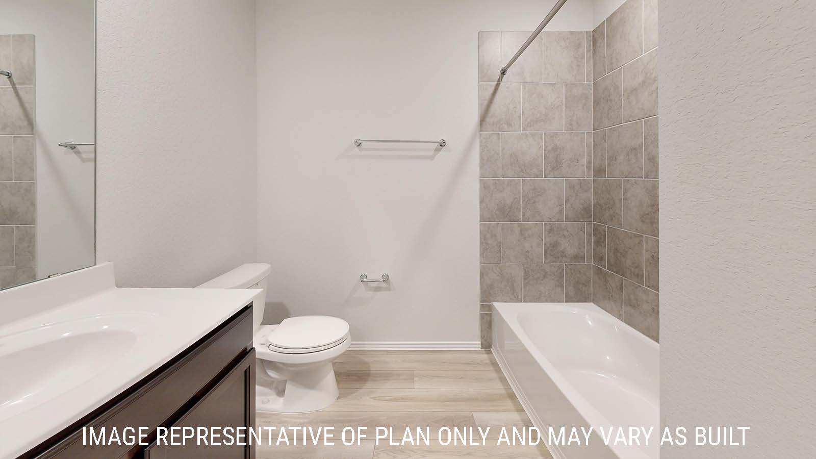 Gaven secondary bathroom with vanity sink and shower and tub combo.