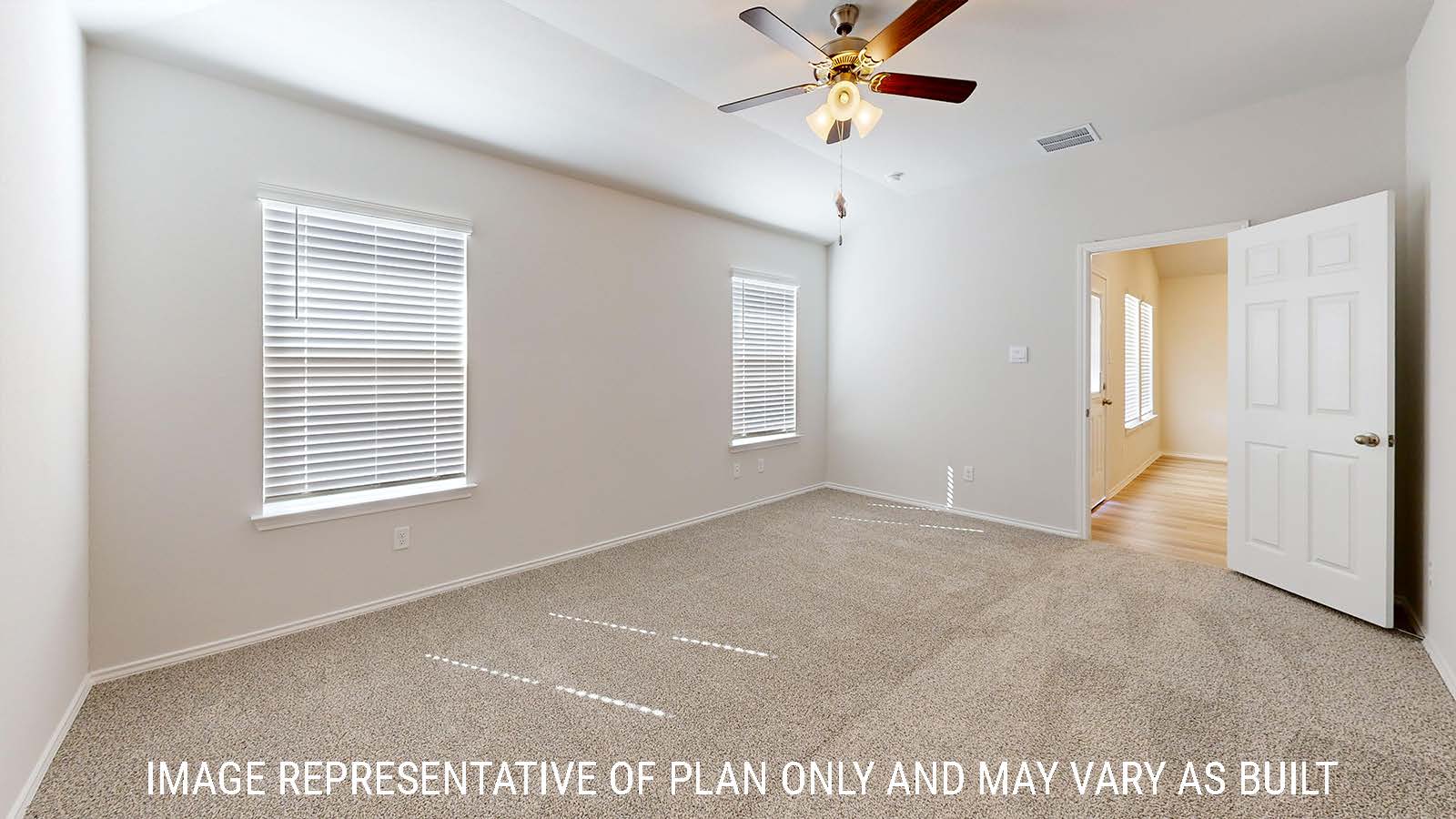 Gaven primary bedroom with carpeted flooring and windows for natural lighting.