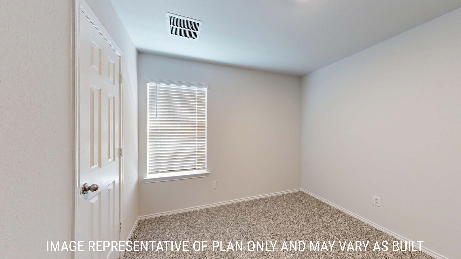 Gaven secondary bedroom with carpeted flooring and window for natural lighting.