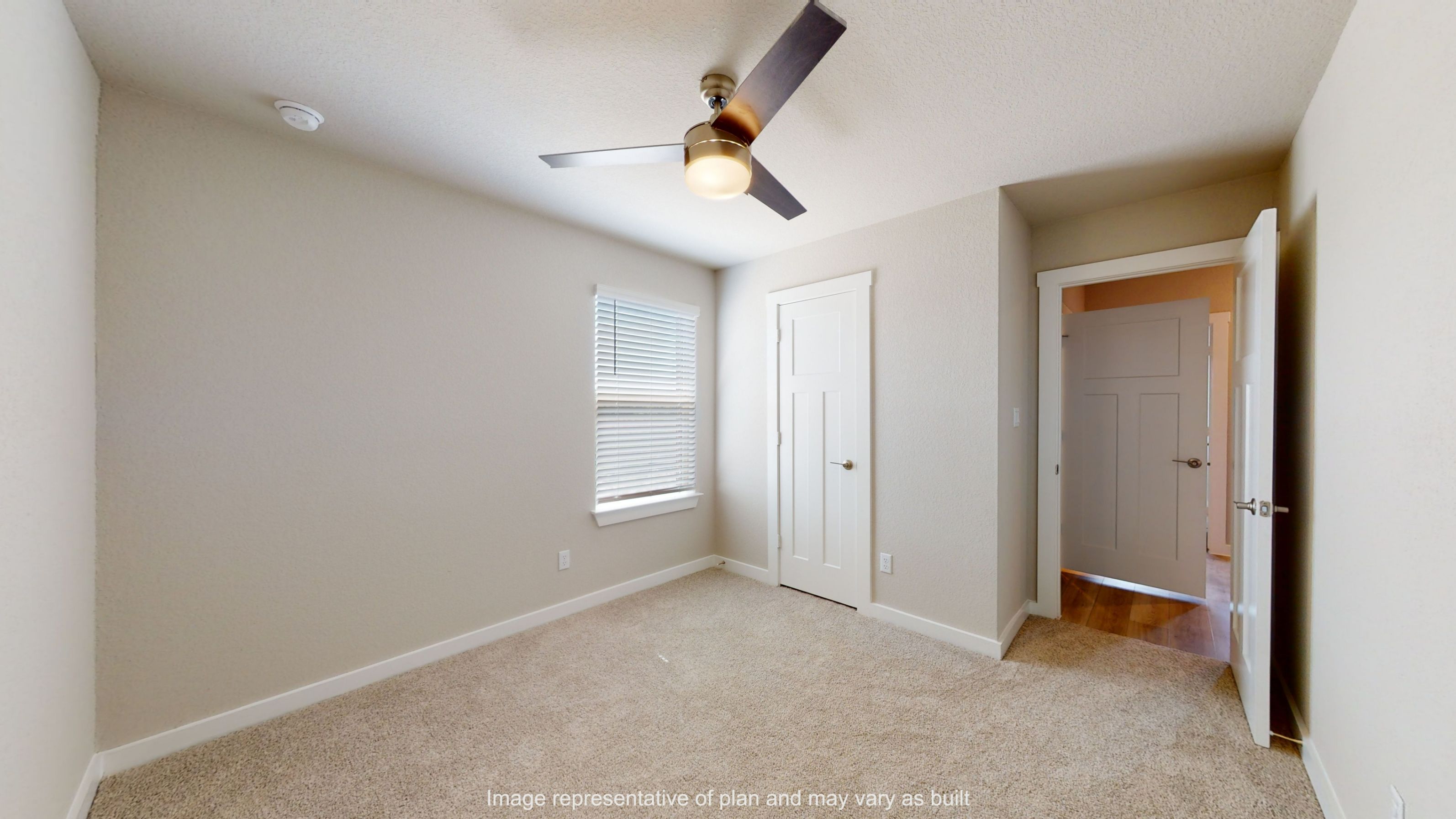 Gaven secondary bedroom with carpet flooring.