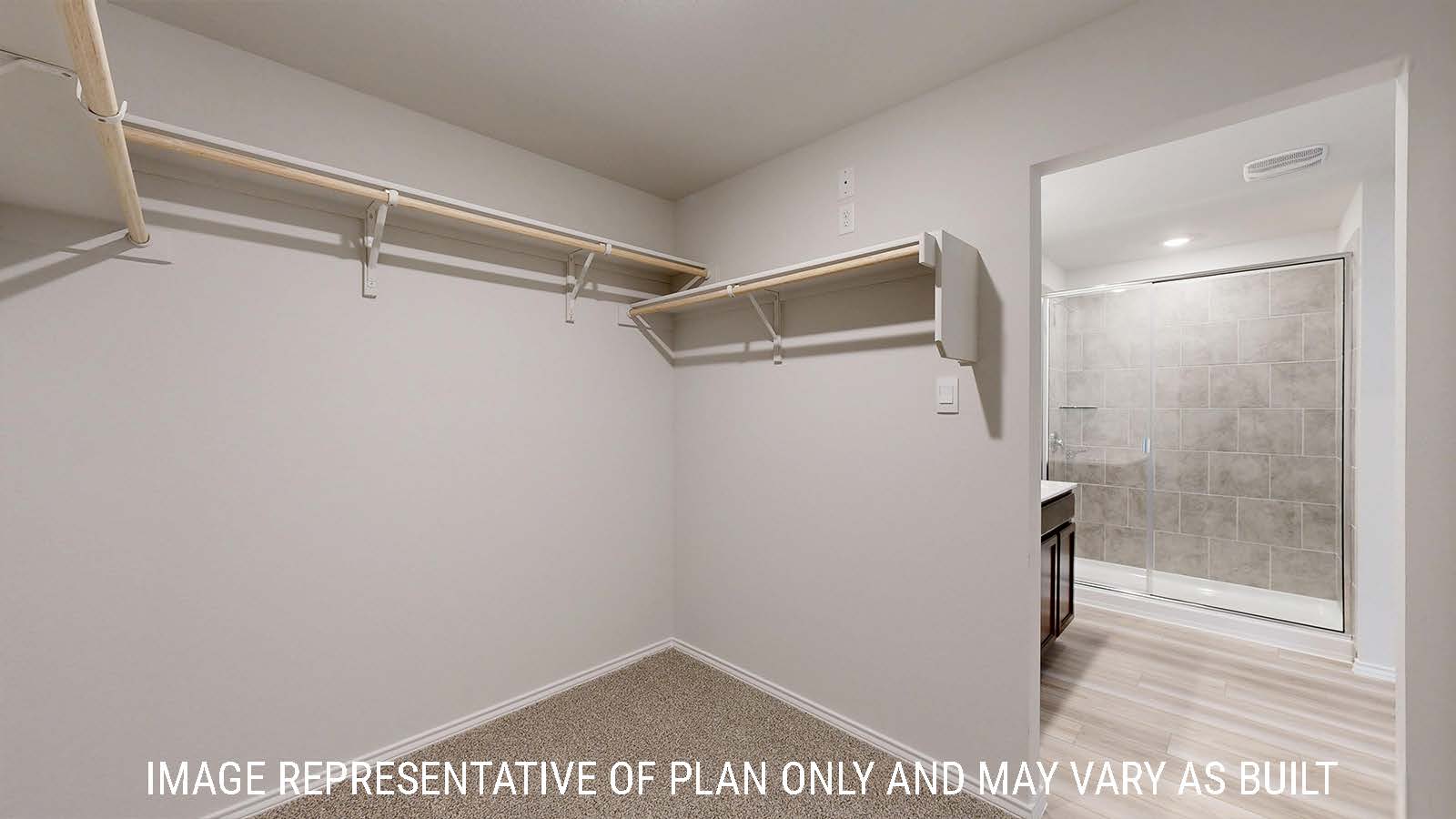 Gaven primary bedroom closet with carpeted flooring and shelving for storage.