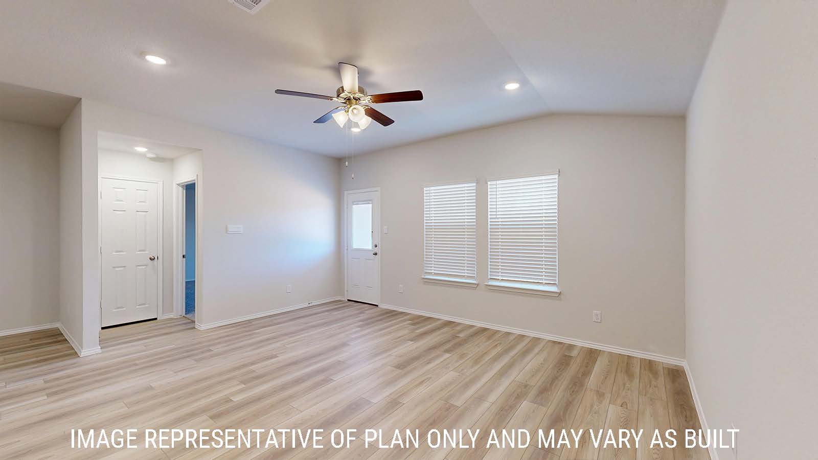 Harris living room with vinyl plank flooring and view of back door to the back yard.