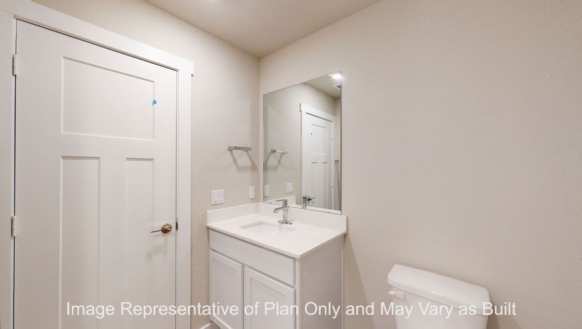 Harris secondary bath with single vanity and toilet.