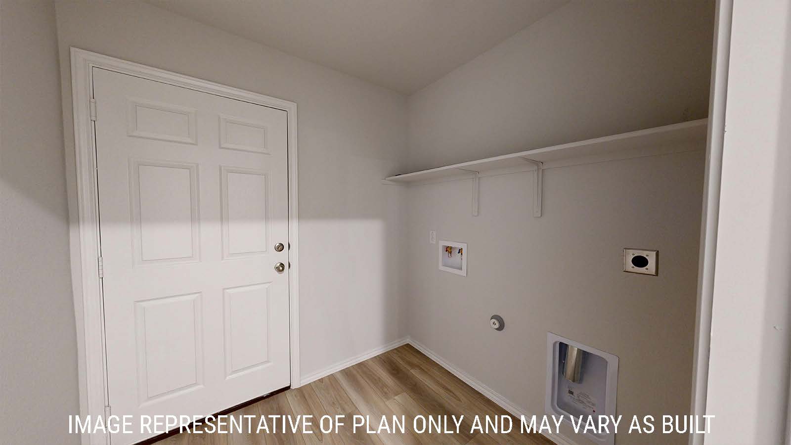 Harris utility room with washer and dryer connections and shelving for storage.