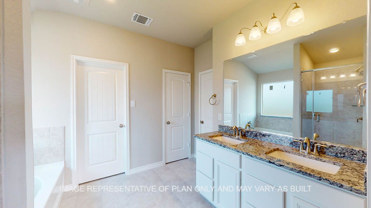 Kiawa primary bathroom with ceramic tile flooring.