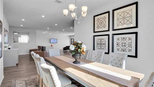 Turnbo Ranch Traditions model home dining room with view of office room.