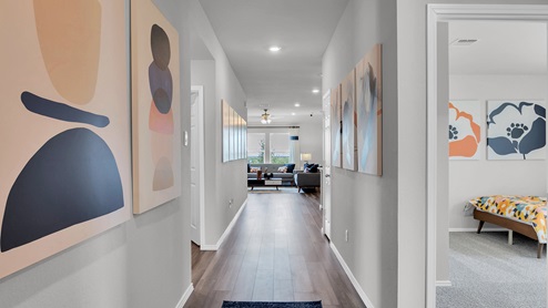 Oak Ridge model home entry with view into secondary bedrooms.