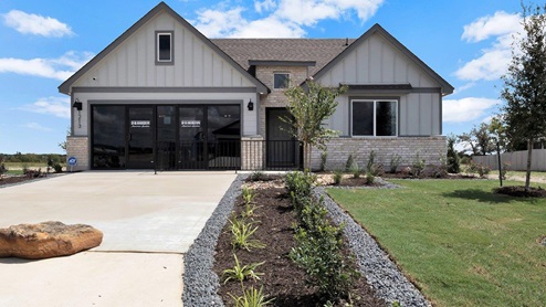 Oak Ridge model home exterior elevation with glass store front doors.