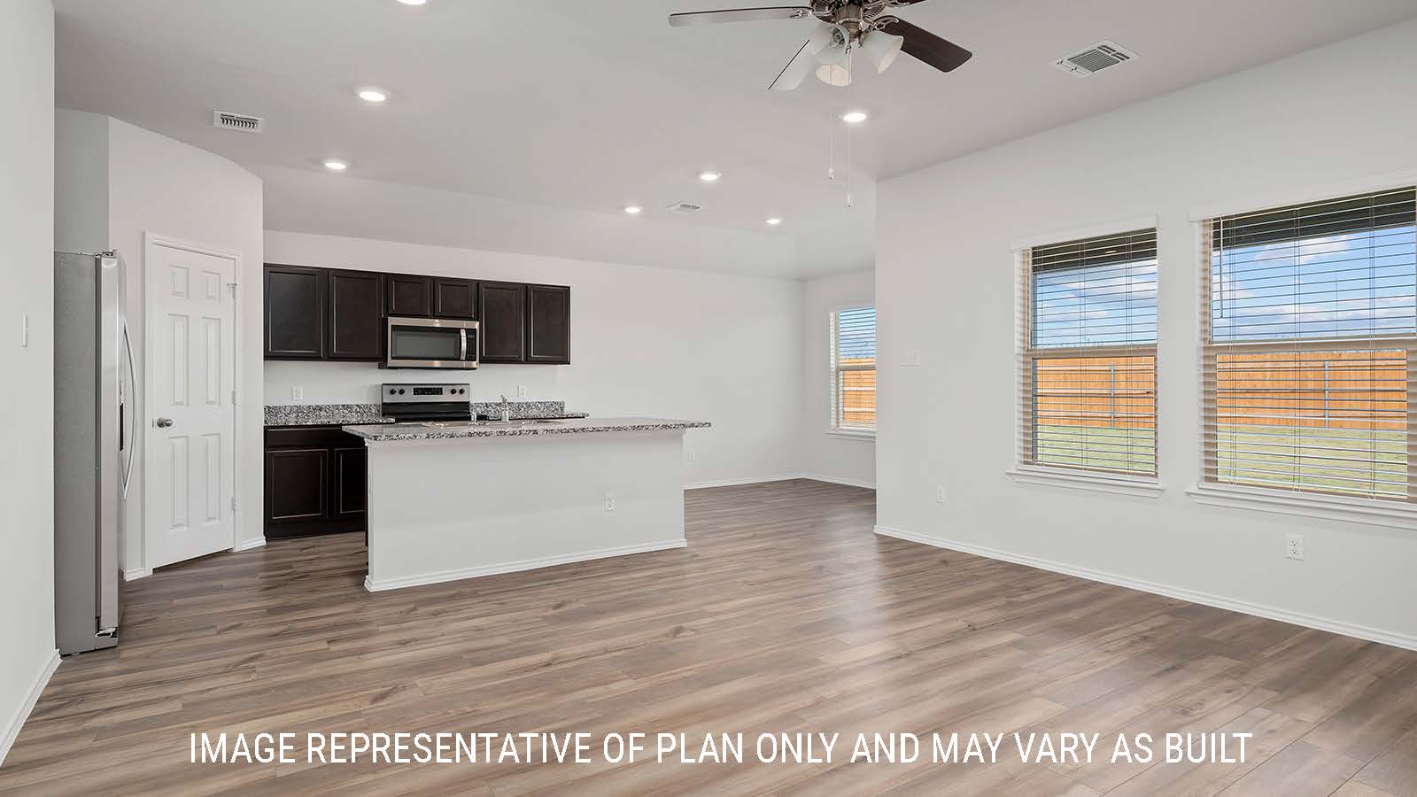 Bellvue living room with view of the kitchen with a center kitchen island.
