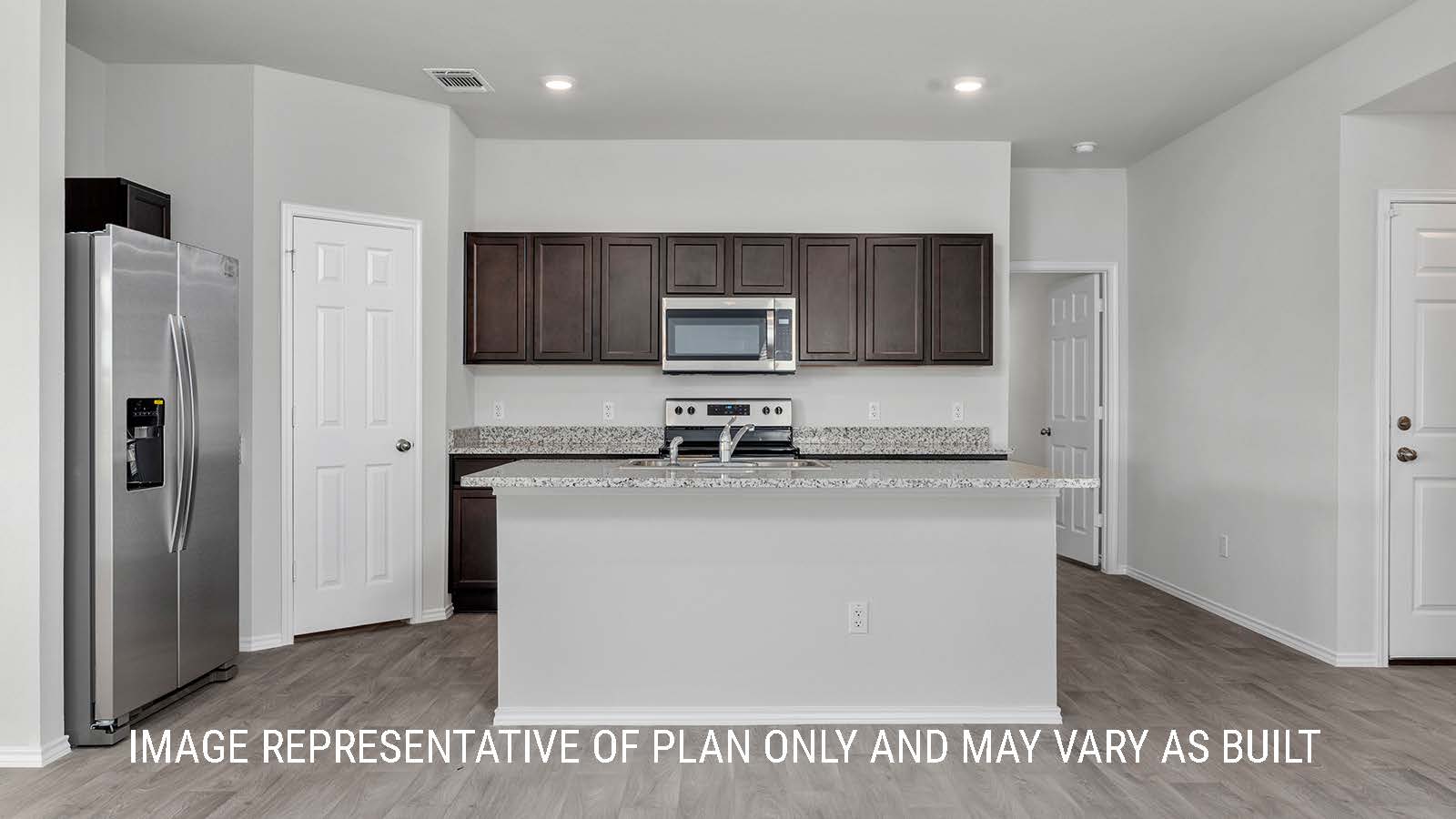 Camden living room with view of kitchen island and granite countertops.