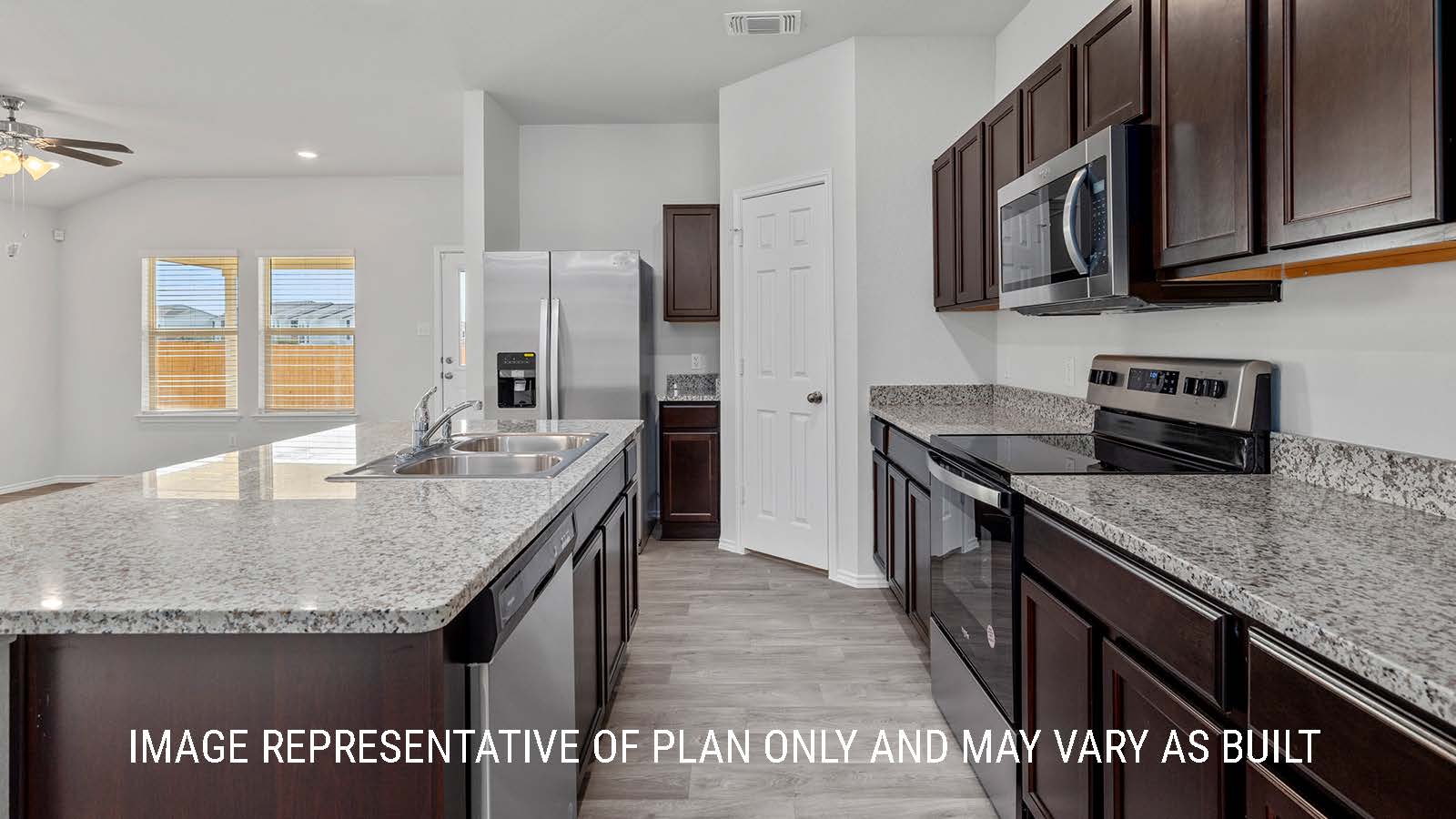 Camden kitchen with granite countertops and dark cabinets.