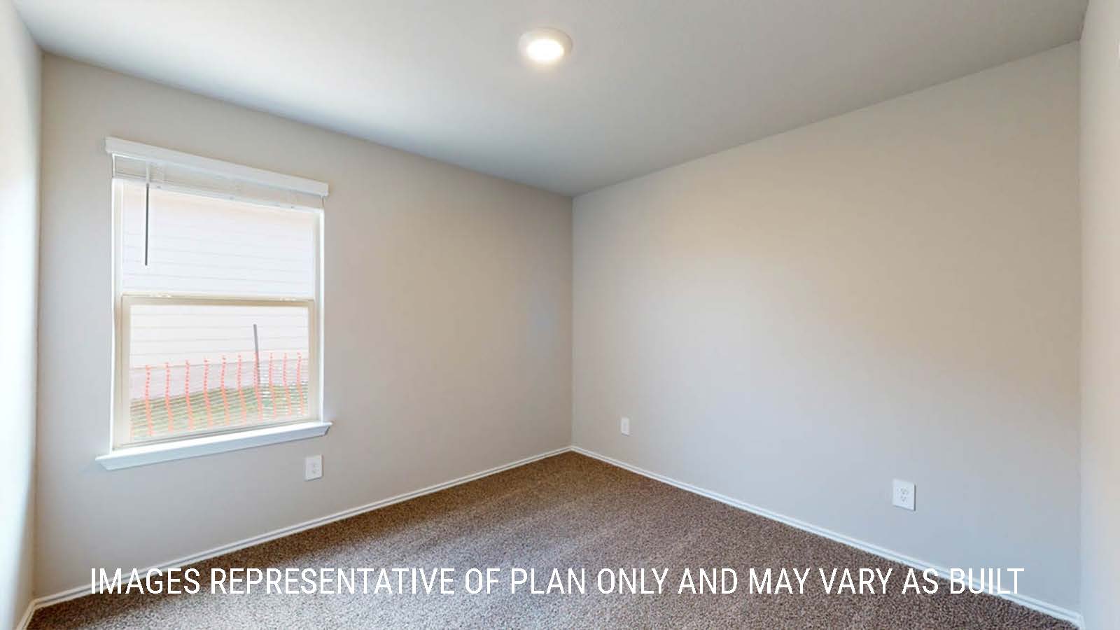Fargo secondary bedroom with window and carpeted flooring.