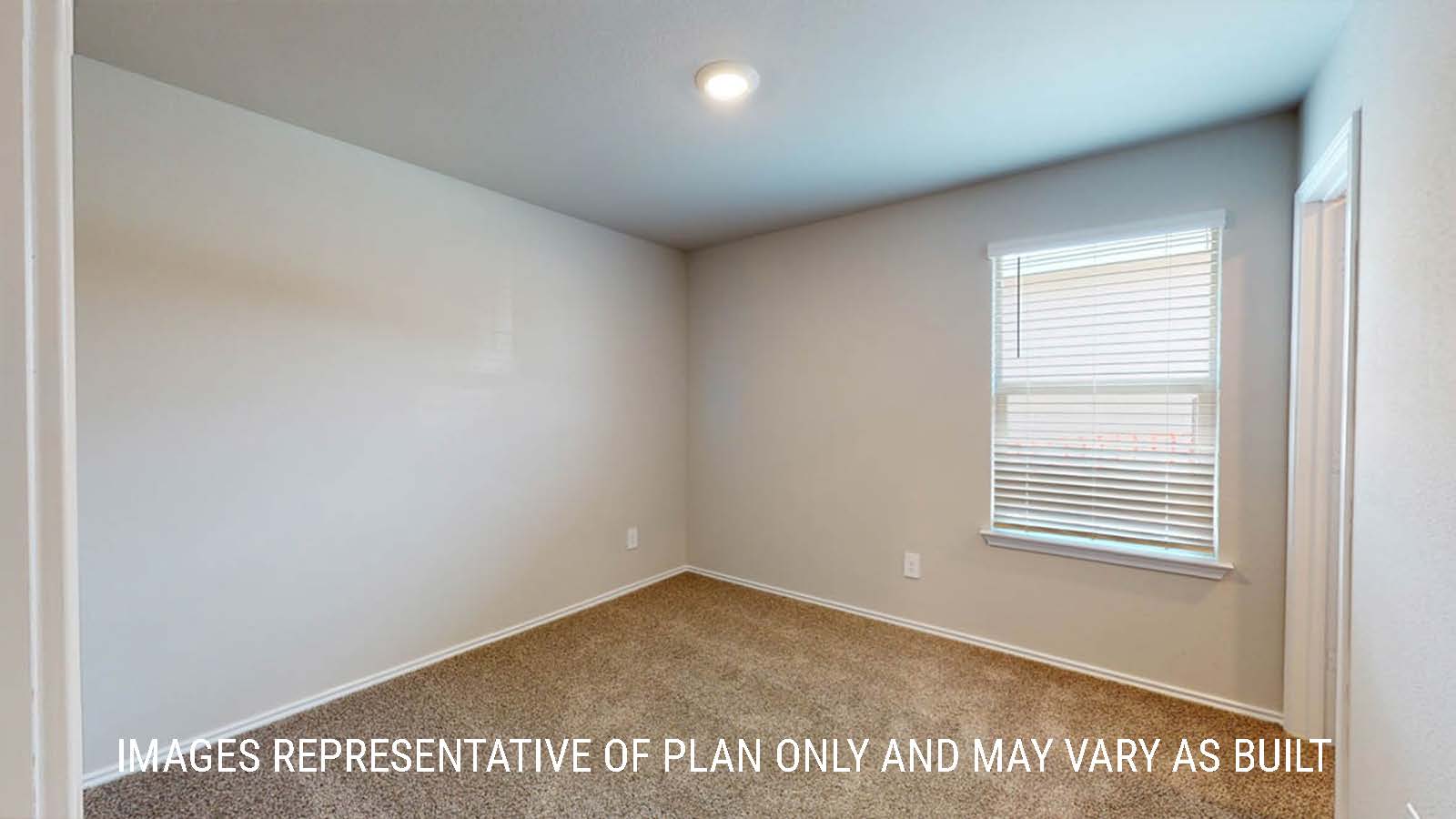 Fargo secondary bedroom with window and carpeted flooring.