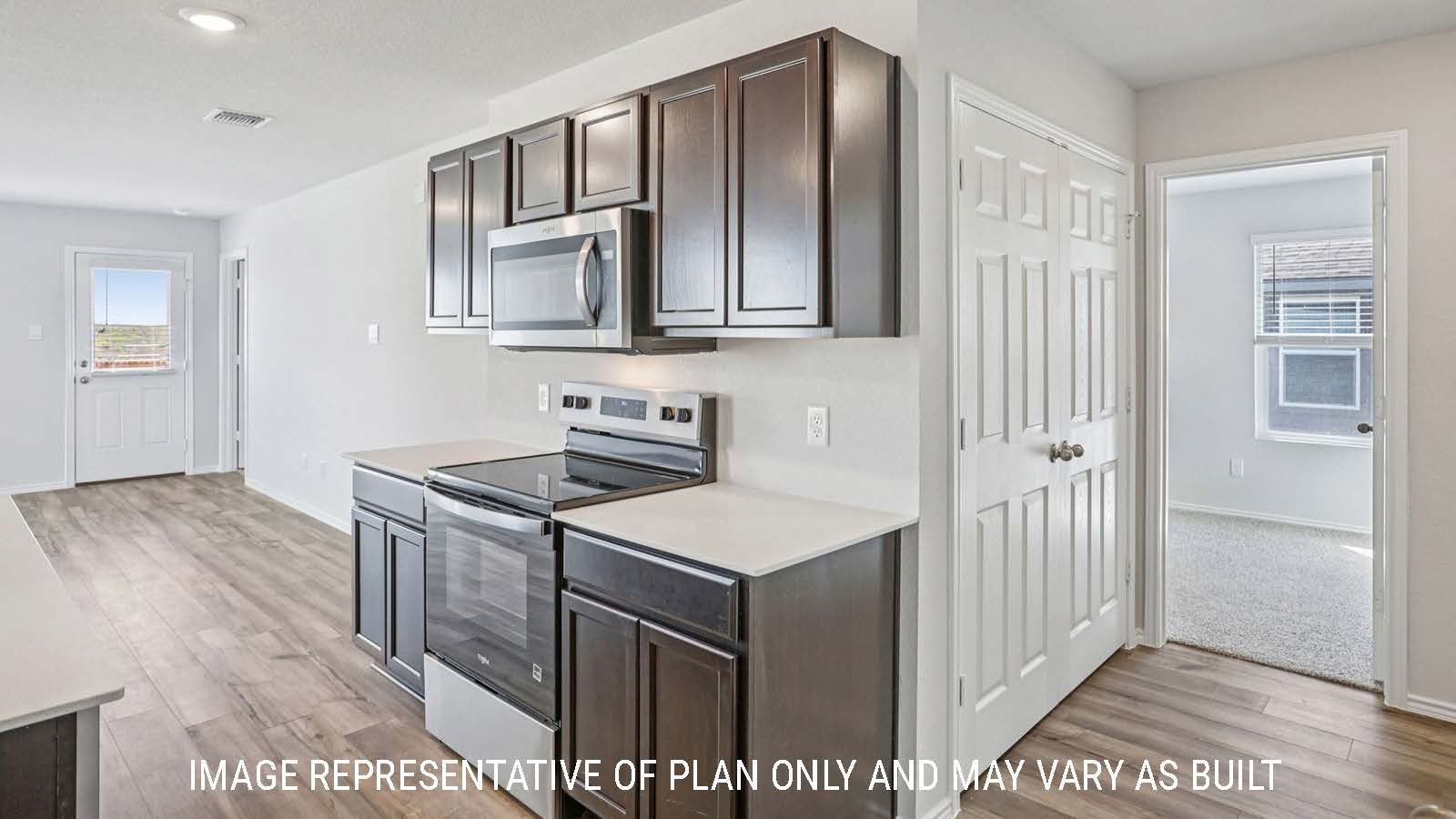 Atlanta kitchen with kitchen island with granite countertops and dark cabinets.