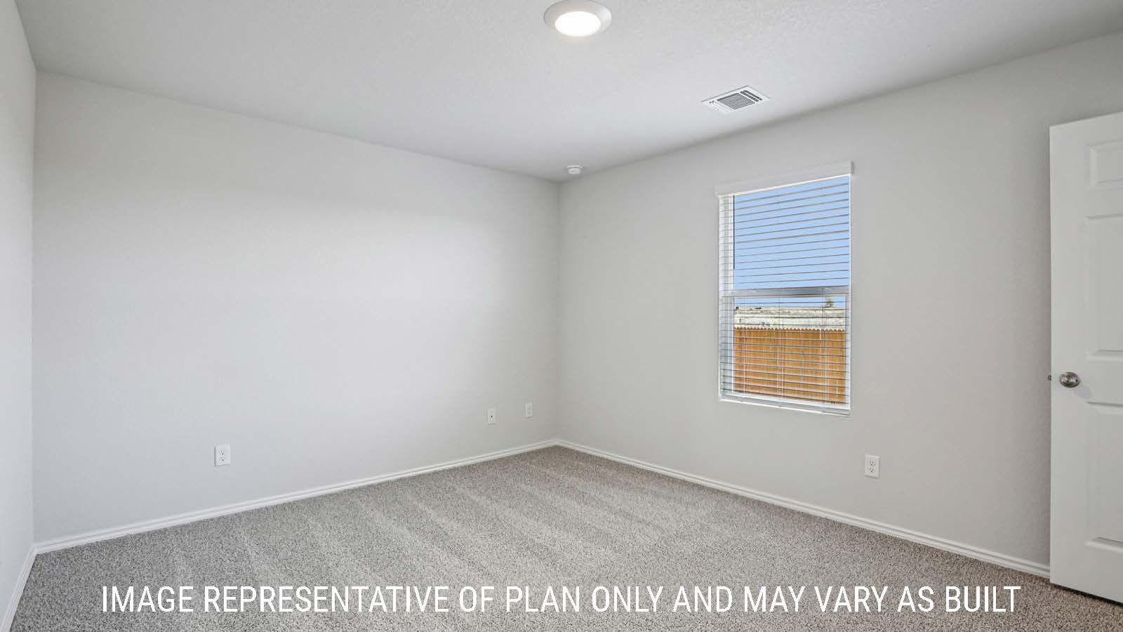 Barton primary bedroom with carpeted flooring and window for lighting.