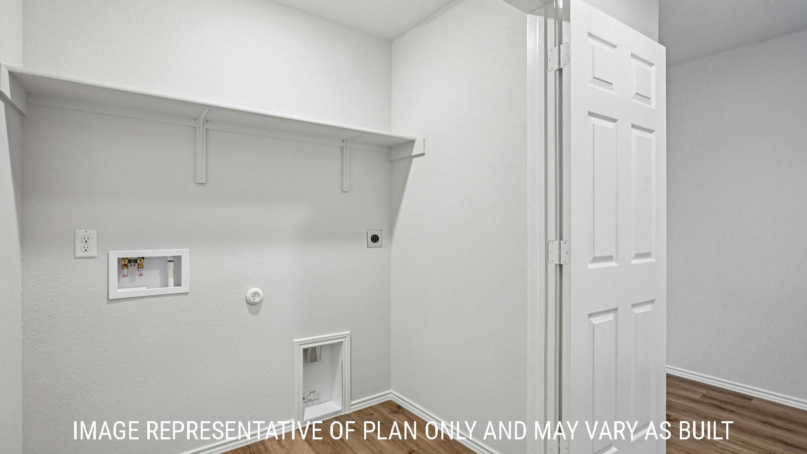 Barton utility room with washer and dryer connections and shelving for storage.