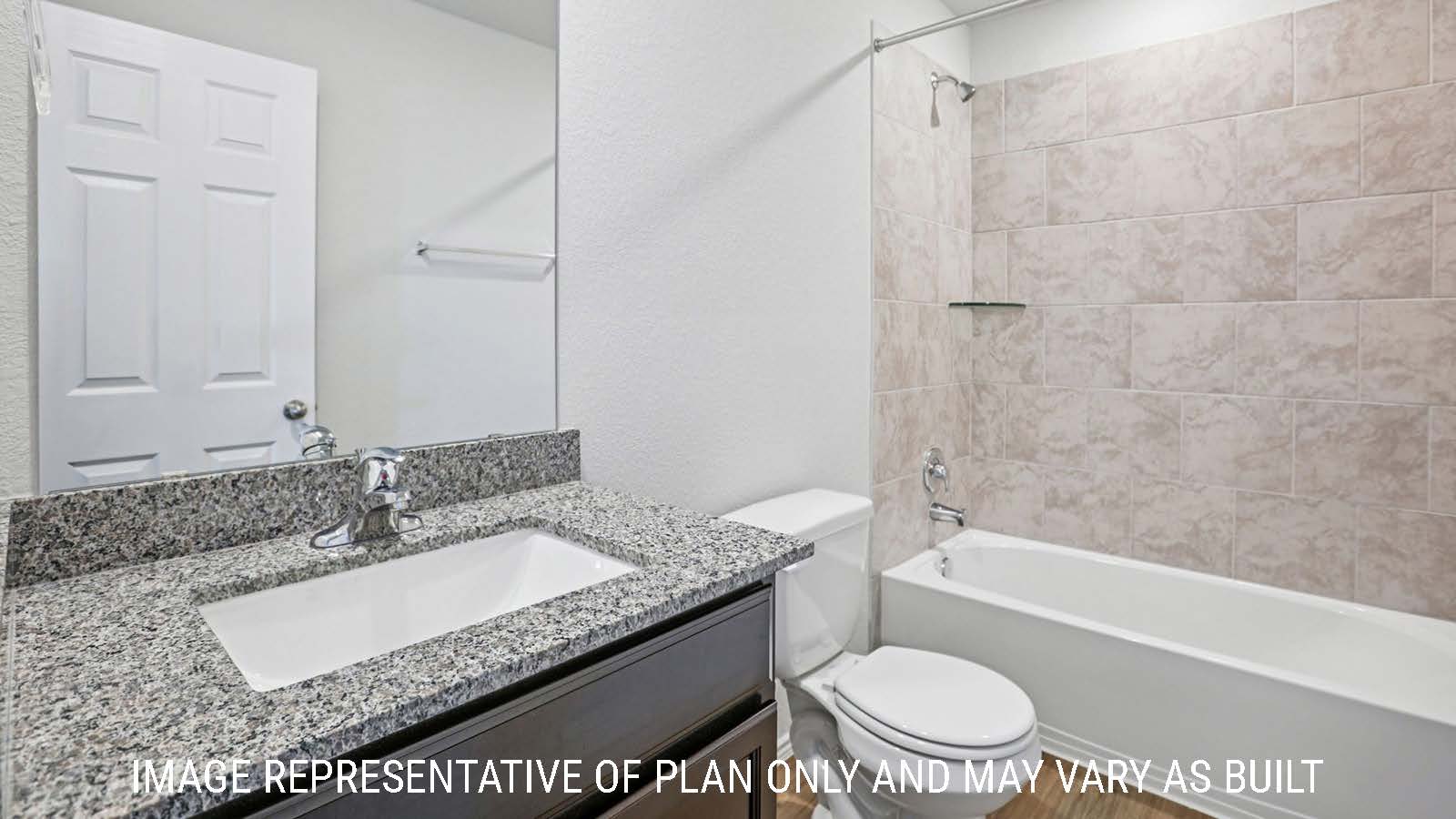 Barton secondary bathroom with vanity sink and shower and tub combo.