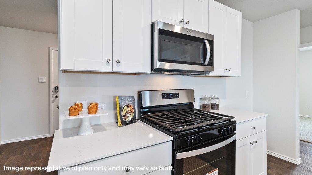 Barton kitchen with white cabinets and granite countertops.