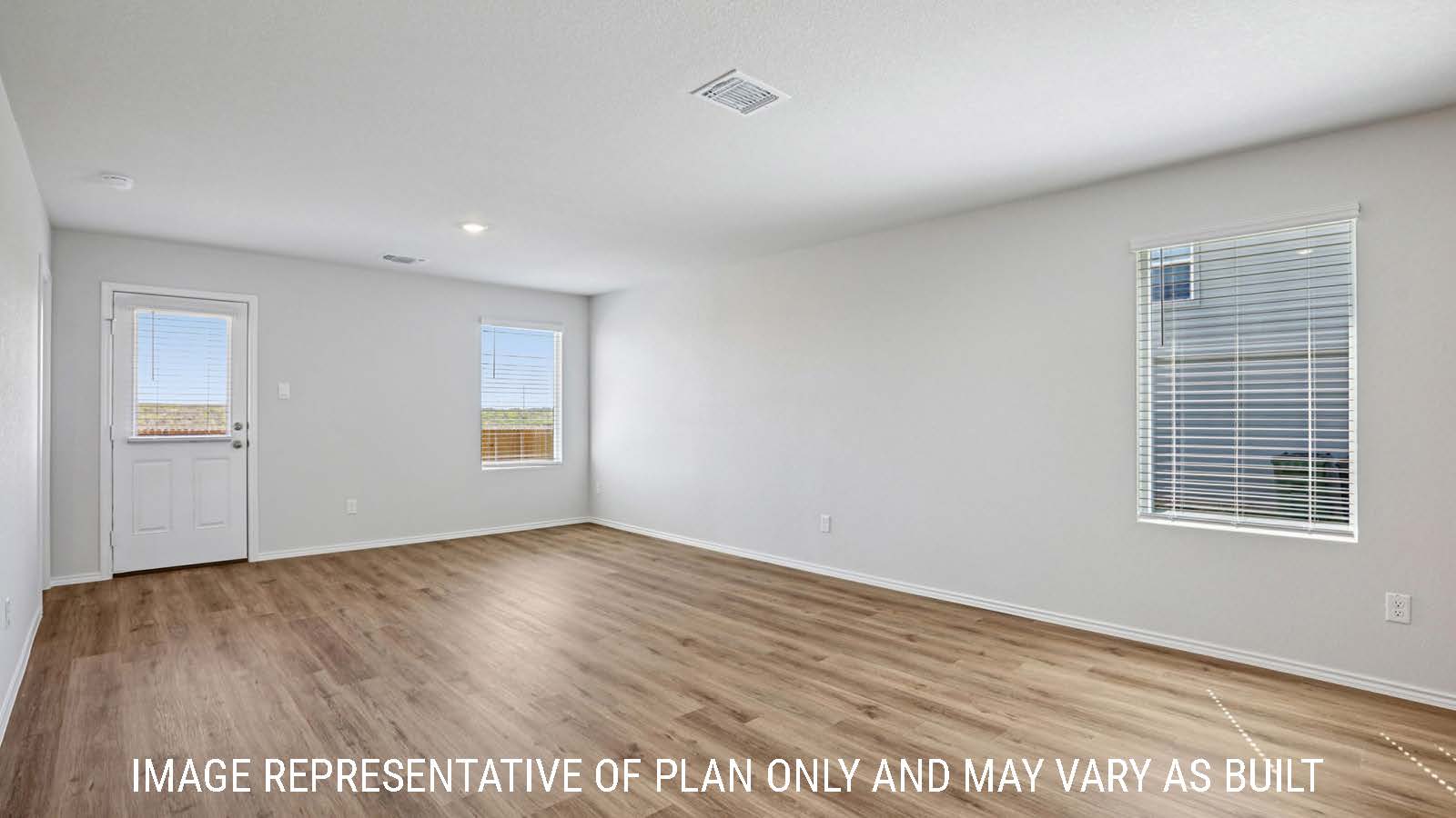 Barton living room with vinyl plank flooring with view of backyard and window for lighting.