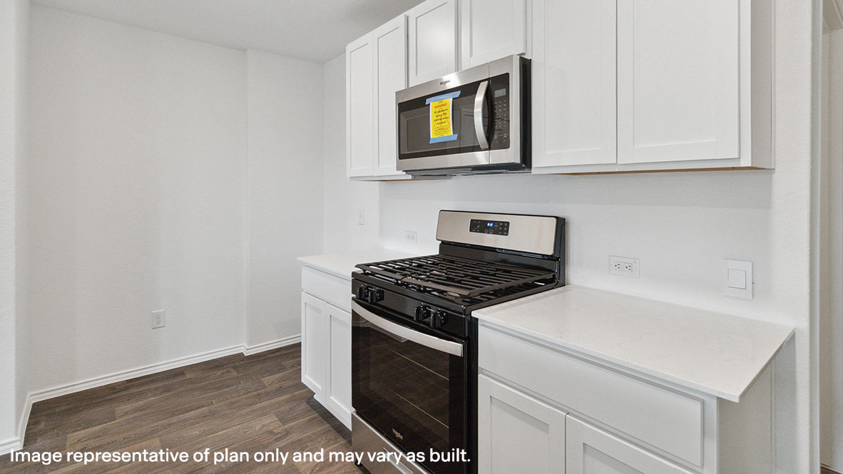 Caprock kitchen with white cabinets and granite countertops.