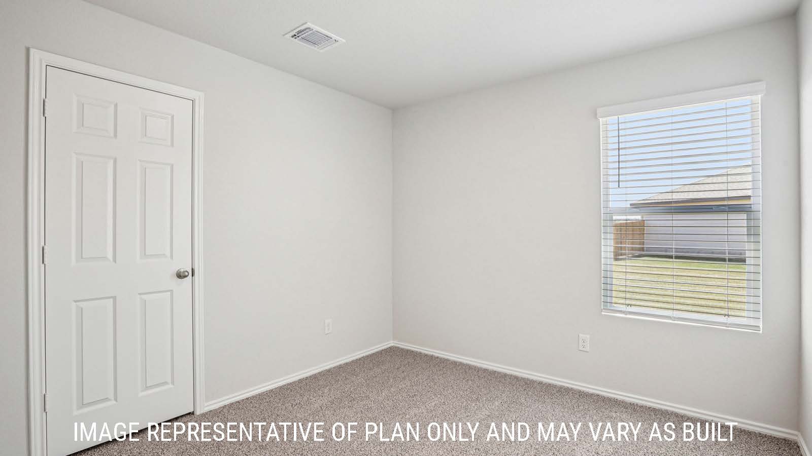 Estero secondary bedroom with carpeted flooring and window for natural lighting.