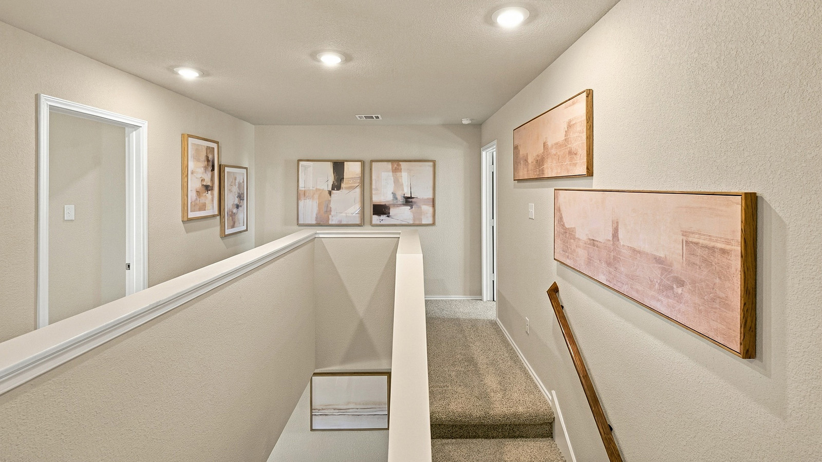 Pepper Creek Crossing model stairs to the second floor and view of secondary bedrooms.