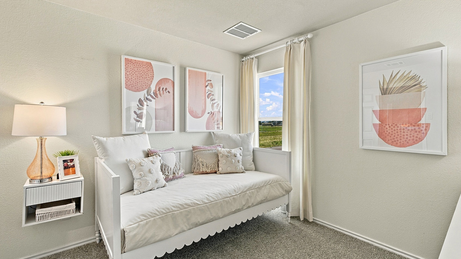 Pepper Creek Crossing model secondary bedroom with carpeted flooring and window for natural lighting.