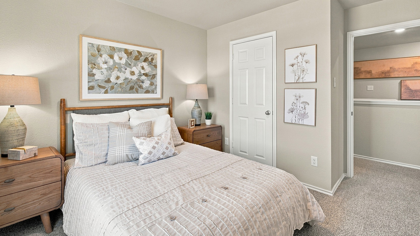 Pepper Creek Crossing model secondary bedroom with carpeted flooring and view of hallway.