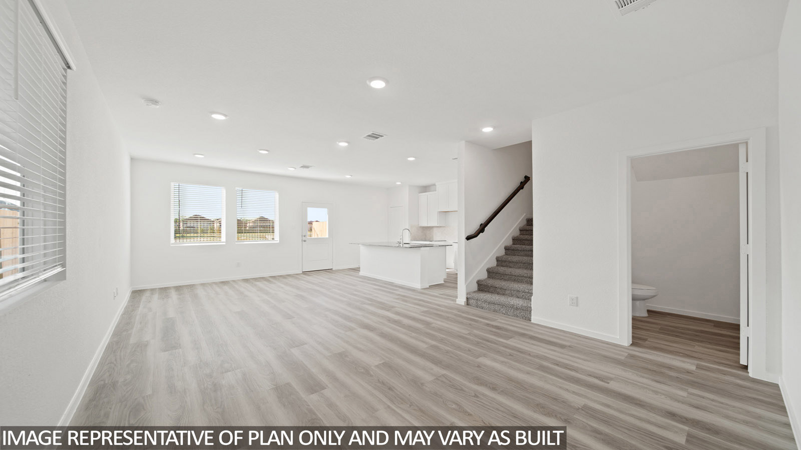 Gardenia living room with vinyl plank flooring and view of open concept dining room and kitchen.
