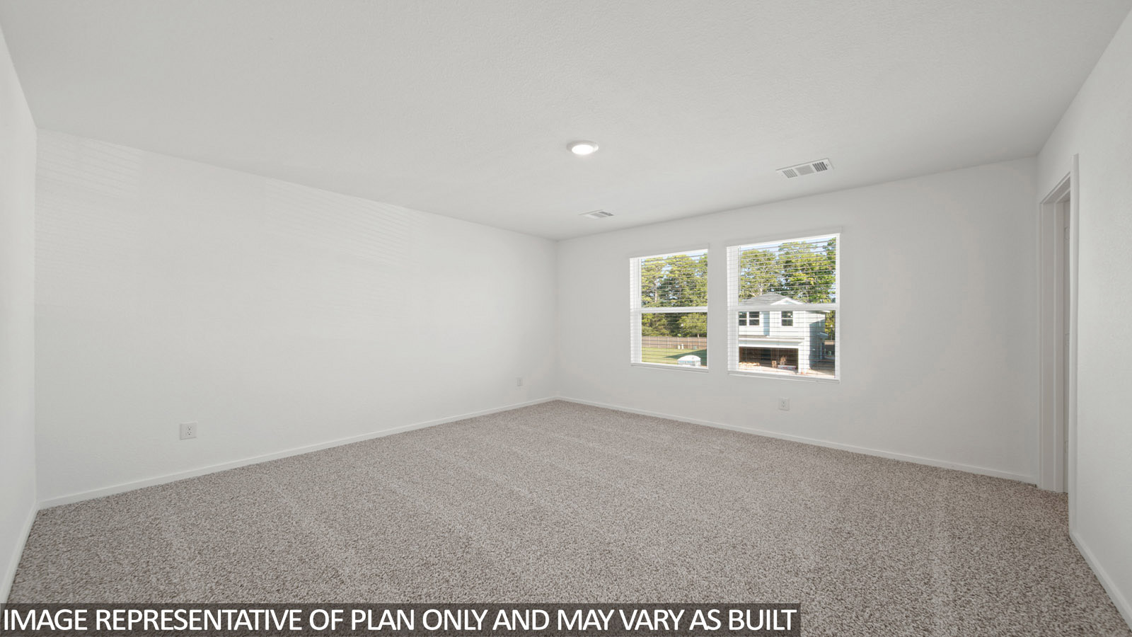 Gardenia primary bedroom with carpeted flooring and windows for natural lighting.