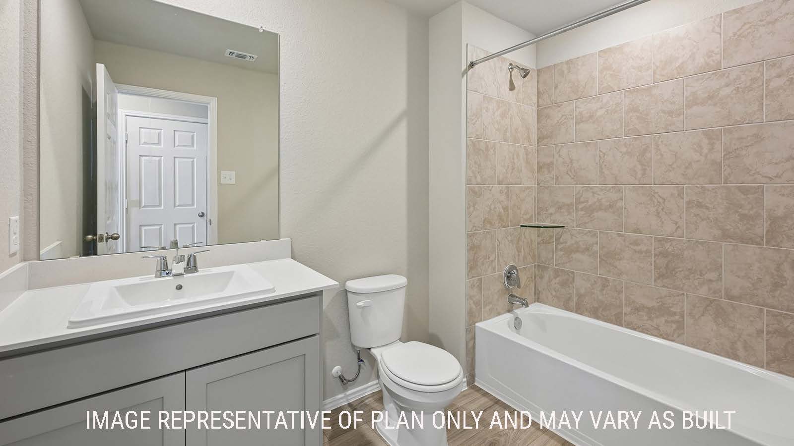 Gardenia secondary bathroom with vanity sink and shower and tub combo.