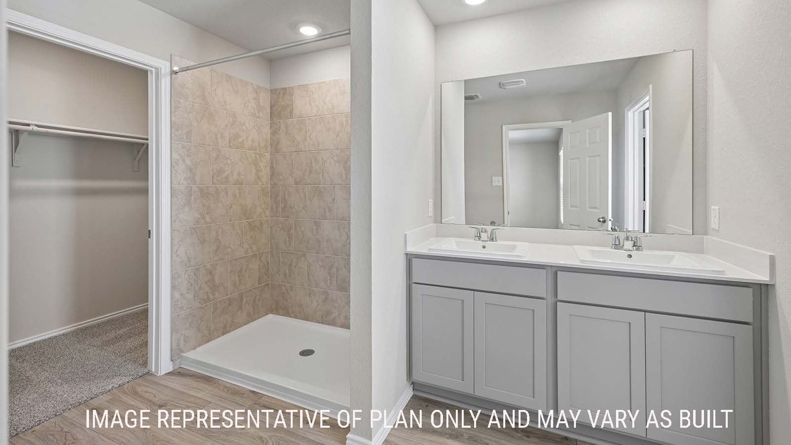 Gardenia primary bathroom with double vanity sink and walk-in shower.