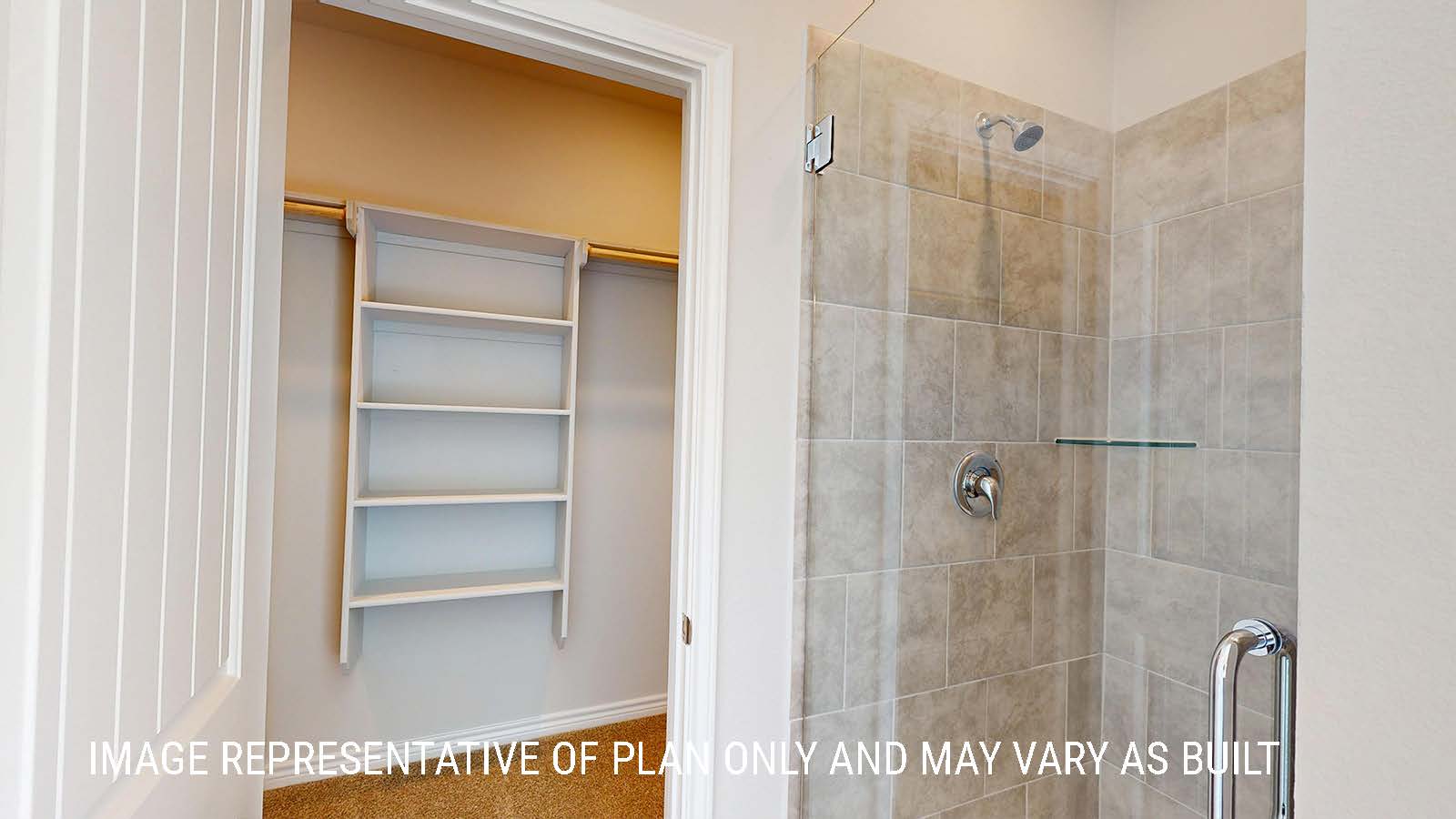 Sonoma primary bathroom with walk-in shower and view of primary walk-in closet.
