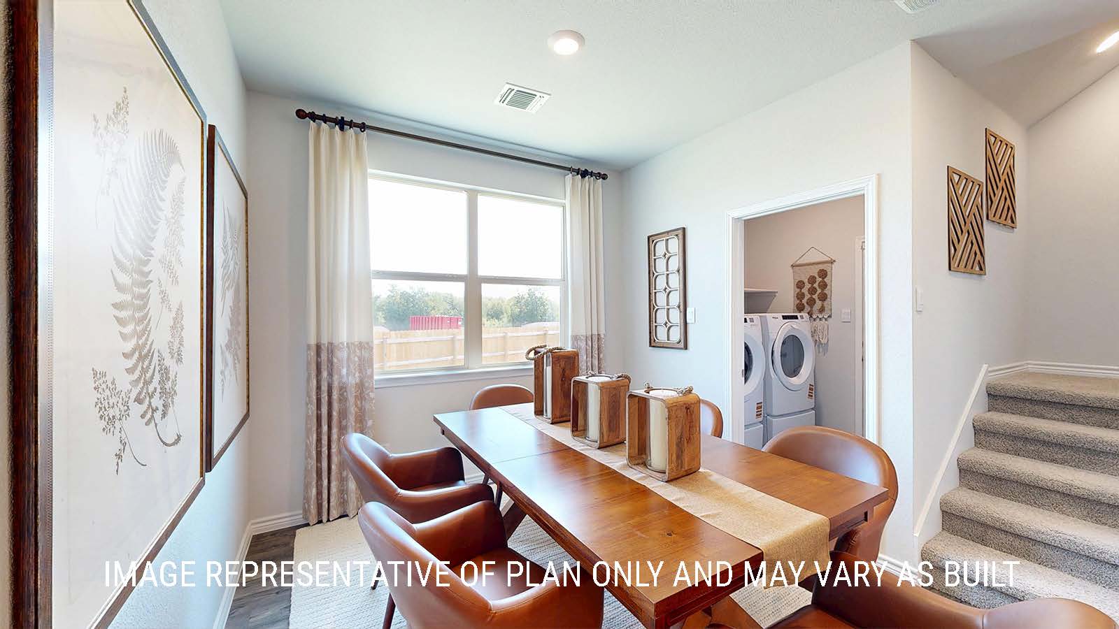 Newburgh dining room with windows for lighting and view of utility room.