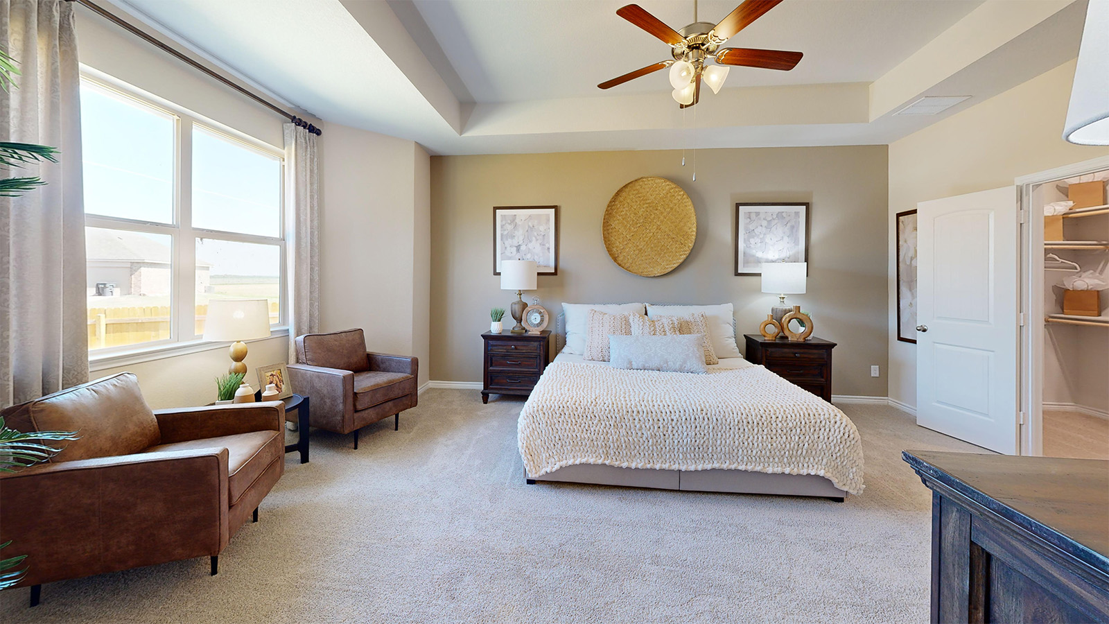 Newburgh primary bedroom with carpeted flooring and view of the primary walk-in closet.