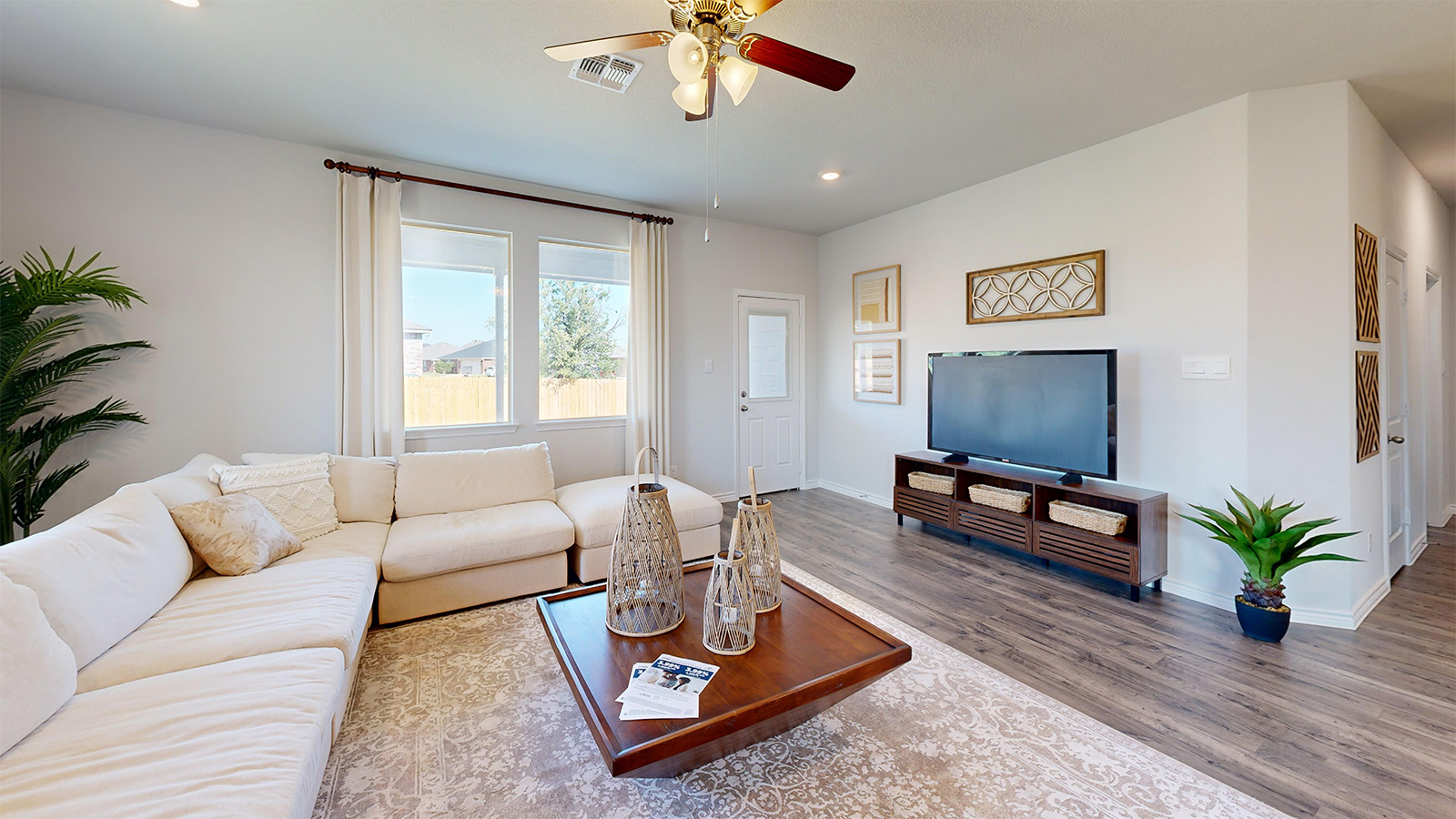 Newburgh living room with windows for lighting and view of back yard.
