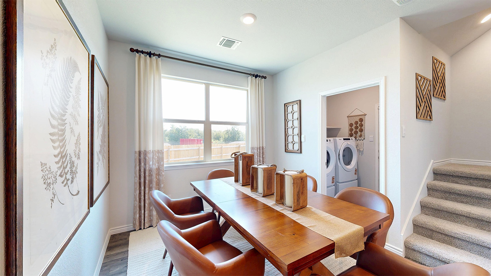 Newburgh dining room with windows for lighting and view of utility room.
