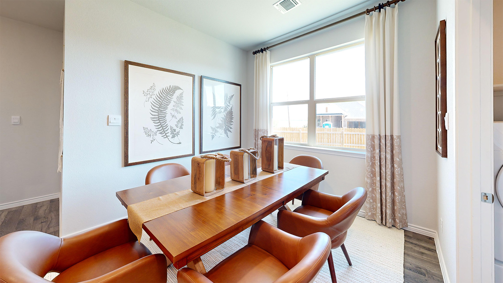 Newburgh dining room with windows for lighting and view of back yard.