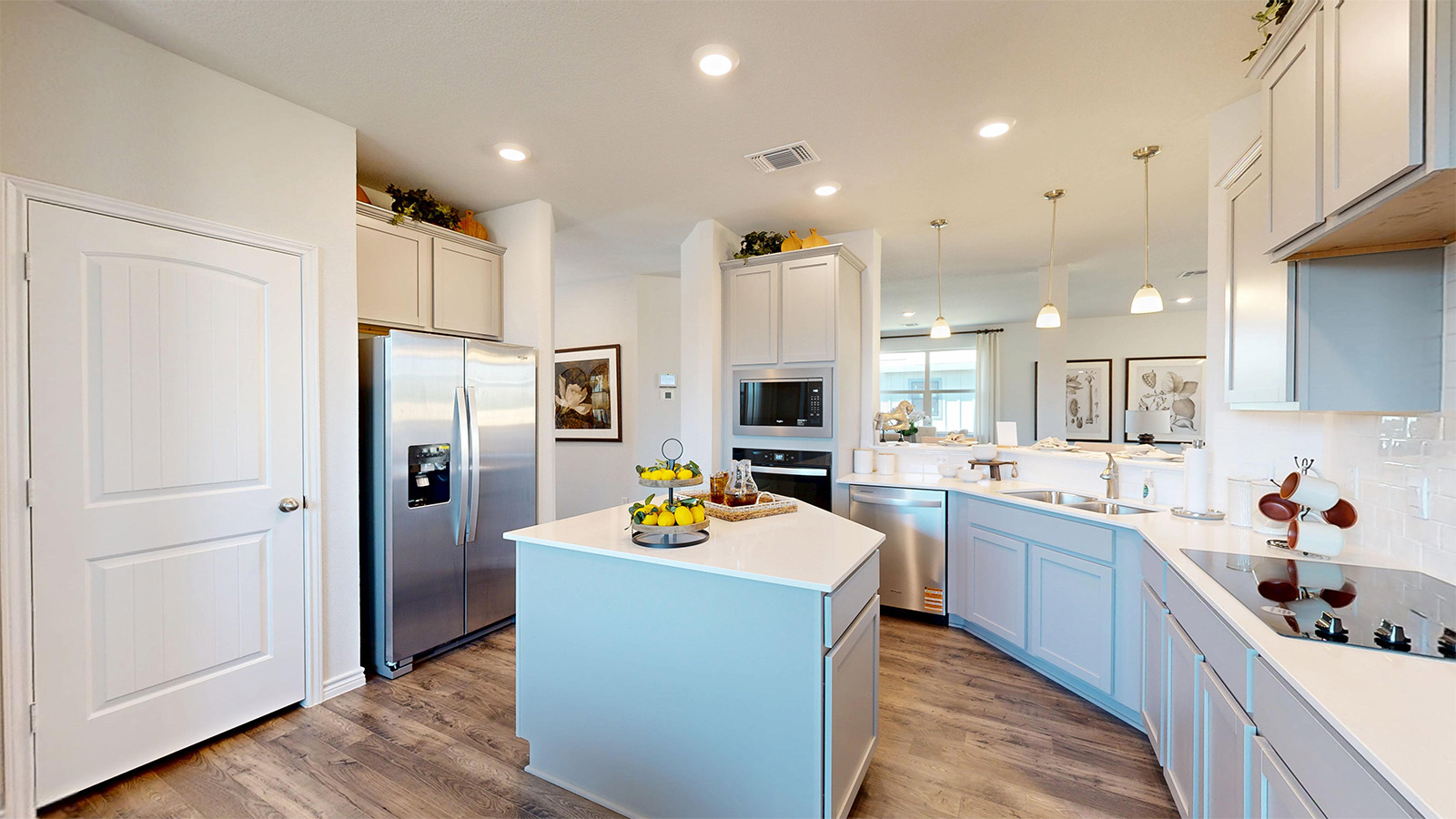 Newburgh kitchen with center kitchen island and light cabinets and granite countertops.