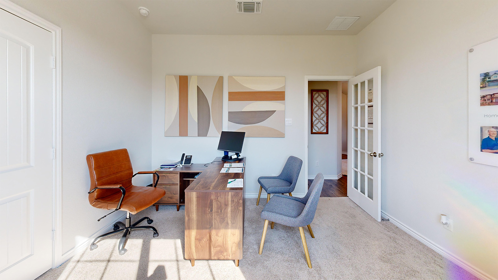 Newburgh office with carpeted flooring and view of entry way hallway.
